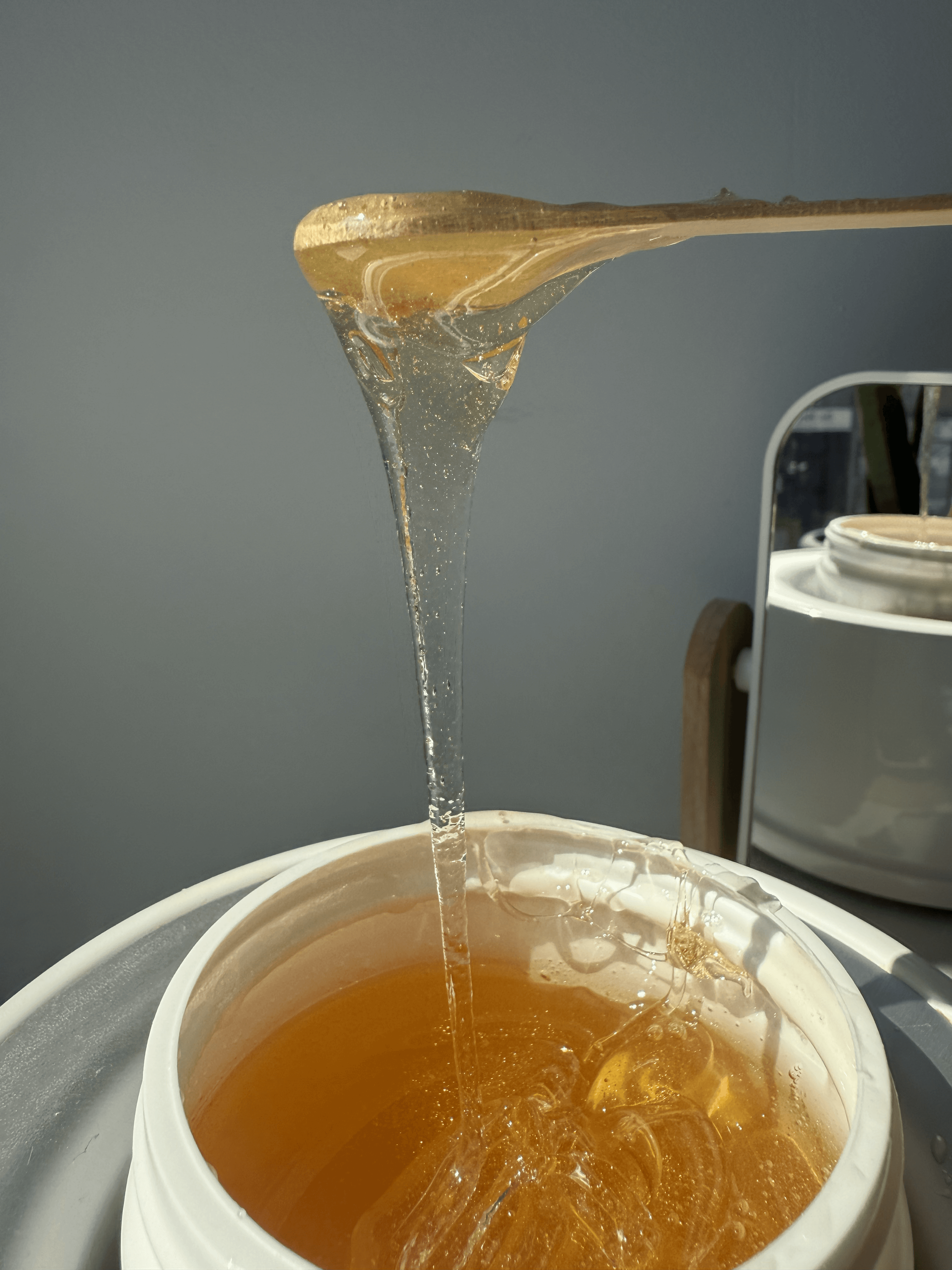 Sugaring paste stretched from an applicator