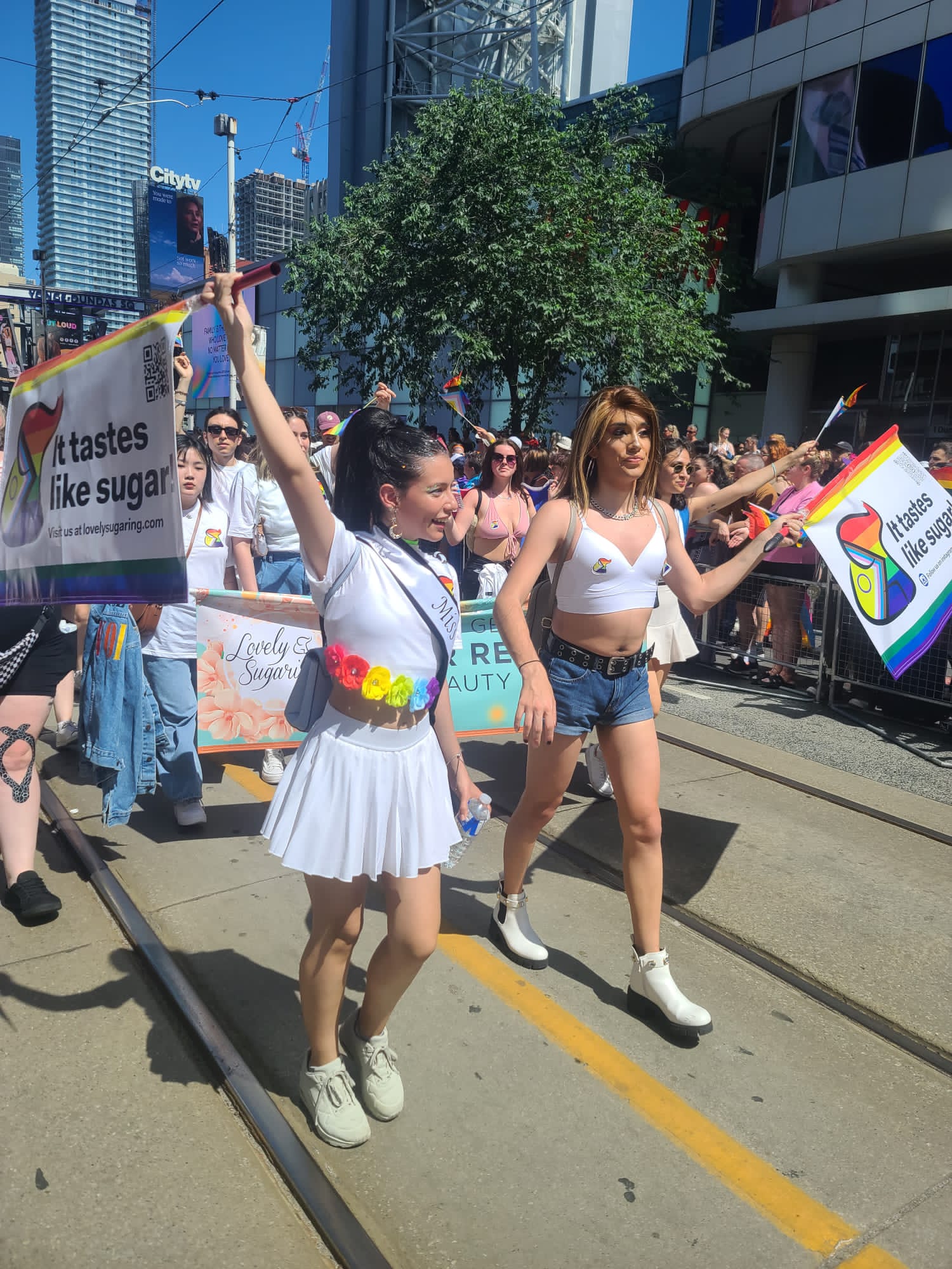 Lovely Sugaring team celebrating at a pride parade